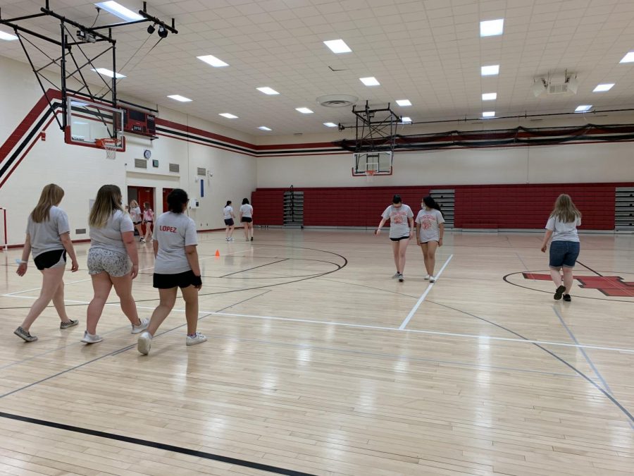 Mrs. Needs 4th hour Red day class is having a fitness day. She said,  The activities I have planed for them today are really fun and I think they will enjoy it. In this picture the students are walking around the gym as a warm-up then are going to play lacrosse.