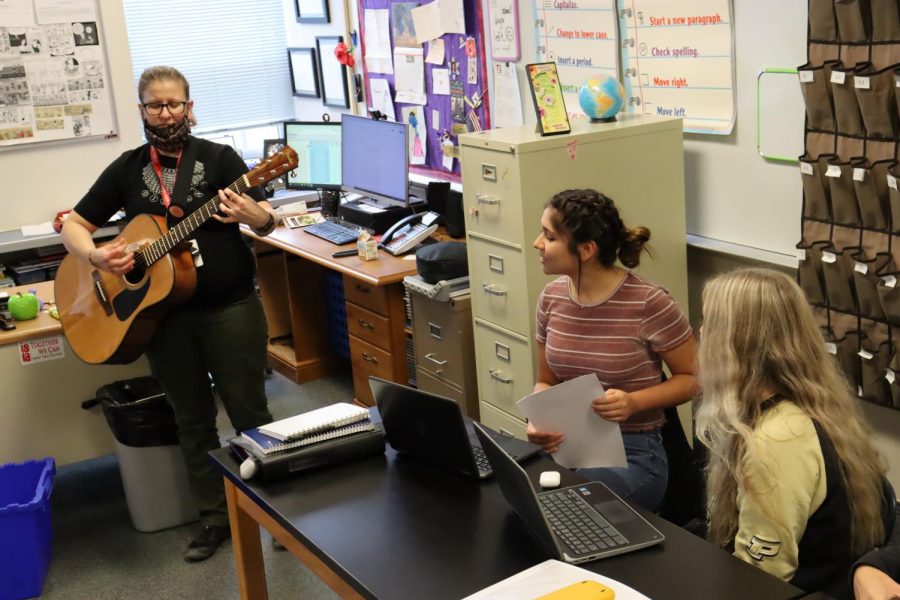 Mrs. Wheeler frequently uses her guitar in class. Students look forward to days she plays it and say it helps them engage in the class.