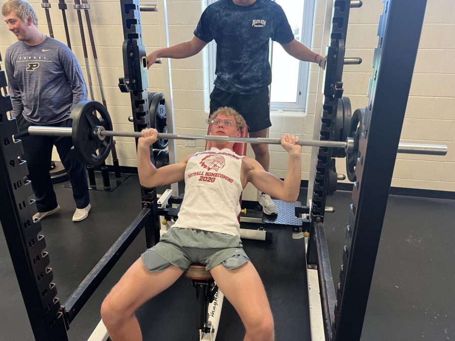 Sophomore+fitness+influencer+Gage+Custer+is+doing+some+pretty+heavy+weight+on+the+bench+press.+Gage+is+in+Mr.+Saylors+A.P.C+class.+When+asked+about+his+favorite+part+about+A.P.C+he+said++My+Favorite+part+is+putting+in+some+work+in+the+weight+room+with+my+friends.++
