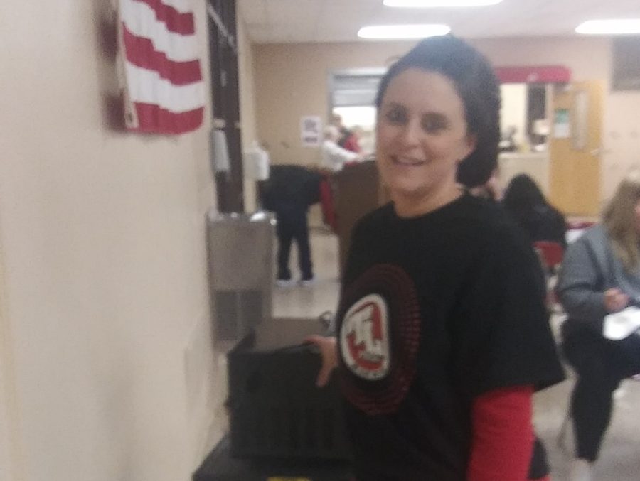 Erin Turner, a member of the high school cafeteria staff, is putting the microwave away after another busy day. Mrs. Turner works hard every day doing what she loves, and still has time to be an amazing mother and wife. Always be a little kinder than you have to be, said Mrs. Turner.