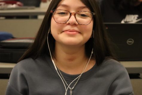 Smiling at the camera, Ariani Labra 26, is in study hall waiting for the bell to ring. My favorite way to pass the time in study hall is to watch movies after I have all my work done, said Labra. She enjoyed her movie after her work was finished.