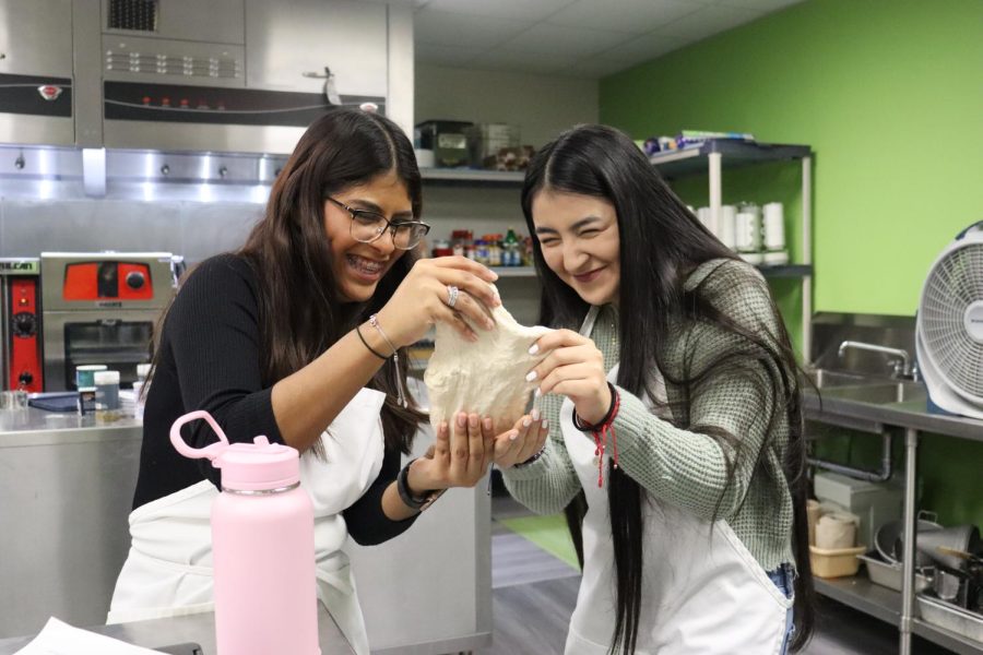 Roselyn Mendez 25 and Niki Merida Montes 25  couldnt stop playing with it.  After they finished with the dough, they were amazed to see the dough made well. Behind the picture, Mendez 25 was seen taking a poke at the dough each second. Dont worry her hands were clean and shiny as glass.