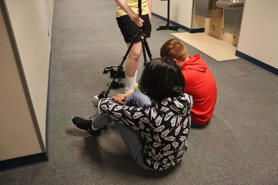 Freshman boys are working toward filming a video for their digital design class. As they are preparing for a studio they are using their time wisely and practicing in the hallway so they have no mistakes in the studio.